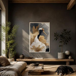 May include: A framed vertical wall art print featuring a stylized red-crowned crane with a white body, black neck, and orange crown. The background consists of abstract, flowing layers in shades of charcoal gray, cream, and metallic gold leaf accents.