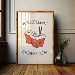 May include: A framed print featuring a hand-drawn illustration of two red Chinese takeout boxes filled with noodles and chopsticks. The text "A Succulent Chinese Meal" is written above and below the image in black font.