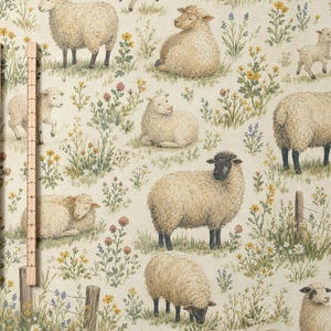 May include: A light beige fabric featuring a repeating pattern of sheep in various poses amidst colourful wildflowers and green grass. Two wooden rulers are placed vertically on the left side, showing measurements in inches and centimetres.