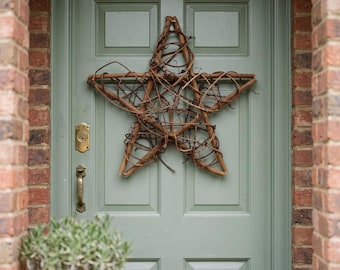 Corona de estrella de vid para la puerta principal | Colgante de puerta rústico de estrella de ramas | Corona de estilo rústico para todo el año | Decoración de pared de estrella de vid natural | casa
