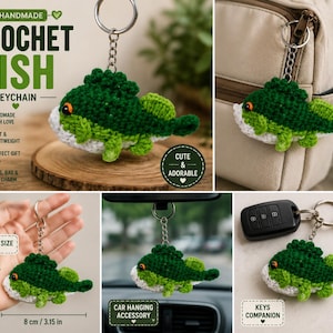 May include: A handmade crochet fish keychain featuring a dark green upper body, light green fins, and a white underbelly with a small orange eye. The keychain includes a metal ring and chain, measuring 8 cm or 3.15 inches in length.