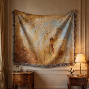 May include: A large tapestry with a classical painting of a woman holding a staff, surrounded by birds and a swirling sky. The tapestry has a fringed edge and is primarily in shades of gold, brown, and blue.