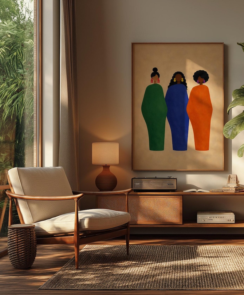 May include: An interior shot features a framed art print with three figures in green, blue, and orange dresses. The artwork hangs above a mid-century modern console with a record player. A beige armchair and a woven side table sit on a textured rug.