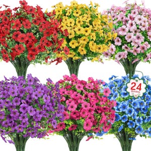 May include: A collection of six bundles of artificial flowers in various colors, including red, yellow, pink, purple, magenta, and blue. Each bundle features numerous small flowers with green foliage and stems. A tag indicates "24 Bundles".