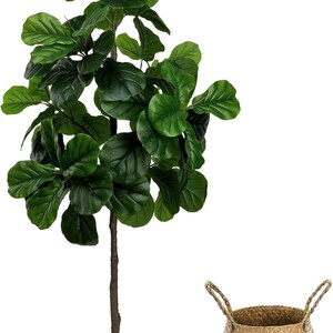 May include: A faux fiddle leaf fig tree with large, vibrant green leaves and a brown trunk, potted in a white cylindrical container. A woven basket with handles is next to the plant. Home decor.
