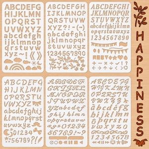 May include: A set of six rectangular white plastic stencils featuring various alphabet letters, numbers, and symbols. The designs include uppercase and lowercase letters in different fonts, numerals, punctuation, and icons like clouds, bows, and arrows.