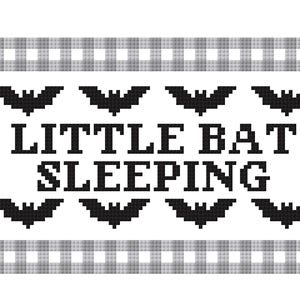 May include: A cross-stitch design with a white background and a gray and white checkered border. The text "LITTLE BAT SLEEPING" is in black, with black bat silhouettes above and below the text.