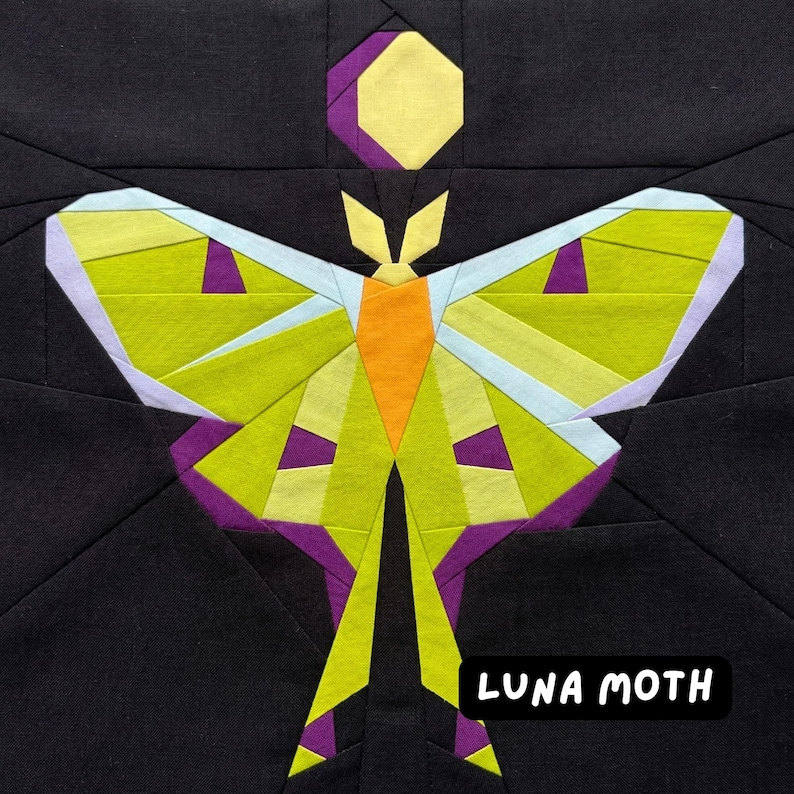 May include: A geometric design of a Luna moth on a black background. The moth features lime green, orange, purple, and light blue accents. The text "LUNA MOTH" is in a white font.