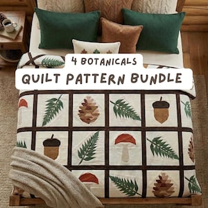 May include: A bed is made with a quilt featuring botanical designs of acorns, pinecones, ferns, and mushrooms. The quilt is bordered with a dark brown trim. The bed is adorned with green, brown, and cream-coloured pillows. The text on the quilt reads "4 Botanicals Quilt Pattern Bundle."