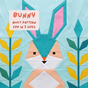 May include: A geometric quilt block featuring a bunny design with a teal head and ears, pink ear interiors, and a peach-colored face. The quilt block includes the text "BUNNY QUILT PATTERN FPP IN 3 SIZES" in a pink rectangle. Yellow and green floral accents are on either side.