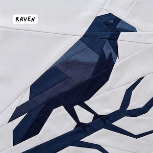 May include: A geometric patchwork design featuring a dark blue raven perched on a branch against a white background. The word "RAVEN" is in a white box in the upper left corner. The raven is made of various shades of blue fabric.