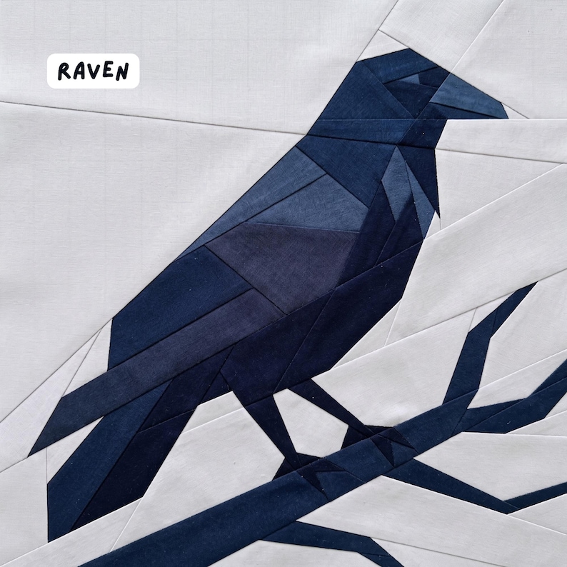 May include: A geometric patchwork design featuring a dark blue raven perched on a branch against a white background. The word "RAVEN" is in a white box in the upper left corner. The raven is made of various shades of blue fabric.