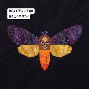 May include: A Death's Head Hawkmoth design, featuring a skull and moth wings in shades of orange, yellow, purple, and brown, set against a black background. The text "Death's Head Hawkmoth" is displayed in a white box.