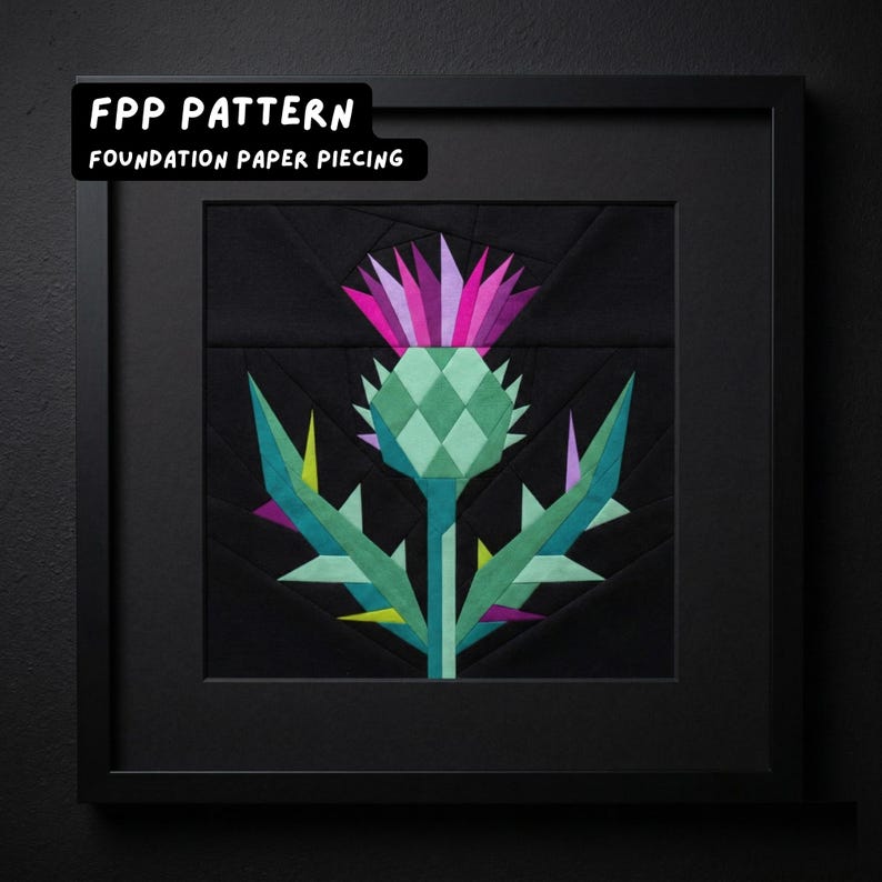 May include: Framed artwork featuring a geometric thistle design. The thistle is rendered in shades of green, purple, and pink against a black background. The artwork is framed in a black square frame. Text at the top reads "FPP PATTERN" and "FOUNDATION PAPER PIECING".