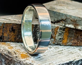 Supergeleiderring van koper en niobium met Franklin Halve Dollar Liner uit 1954