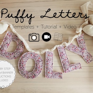 May include: A banner spelling "DOLLY" made of puffy fabric letters with a floral pattern. The banner includes templates, a tutorial, and a video. The banner is decorated with cream-colored bows and the text "Step by Step Custom Banner Instructions Included".