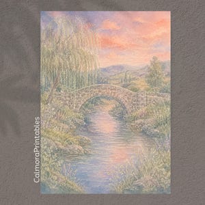 May include: A watercolor painting depicting a stone arch bridge over a calm stream, surrounded by a weeping willow and wildflowers. The sky is filled with soft pink and orange sunset clouds. The text CalmoraPrintables is printed vertically.
