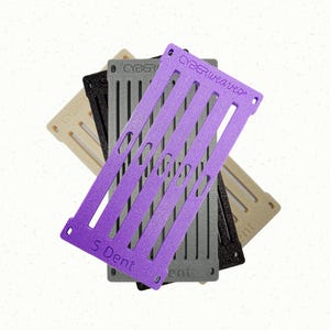 May include: A set of three ceramic mugs with a speckled, matte finish. The mugs are in shades of cream, light gray, and dark gray. Each mug has a simple, minimalist design, perfect for coffee or tea.