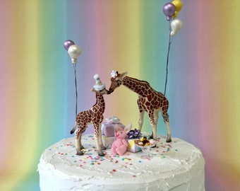 Giraffe and calf cake topper with balloons ,present stacks, toy, miniature cakes and optional cake bunting. Baby shower cake topper.
