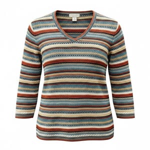 May include: A V-neck sweater featuring a horizontal striped pattern in shades of blue, rust orange, cream, and tan. The knit garment has three-quarter length sleeves and a textured stitch throughout, with a visible brand label at the inner neckline.