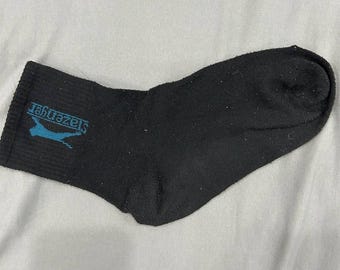 A single old black sock for men VN1717