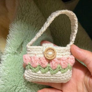 May include: A set of three ceramic mugs with a speckled, matte finish. Each mug features a different color: light blue, cream, and gray. The mugs have a simple, modern design, perfect for coffee or tea.