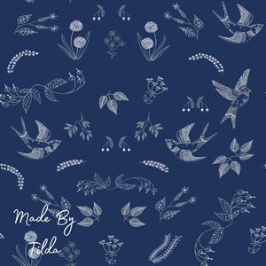 May include: A navy blue fabric with a repeating white pattern of birds, flowers, and leaves. The words "Made By Tilda" are in the lower left corner. The design is detailed and delicate, creating a nature-inspired aesthetic.