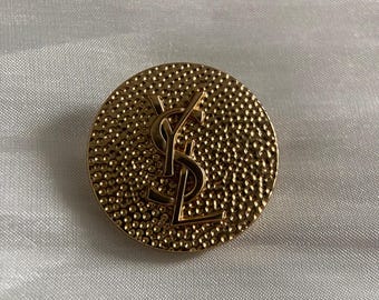 Botón metálico vintage dorado