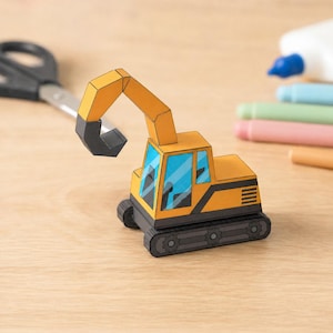 May include: A papercraft excavator model featuring a yellow body, a black articulated arm, and blue windows. The construction vehicle has dark gray tracks with visible gear details on the sides and a cab structure with black accents and vents.