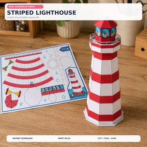 May include: A papercraft model of a striped lighthouse with red and white horizontal bands, featuring a lantern room with blue windows. Beside it lies a flat A4 sheet containing printed templates, diagrams, and instructions for assembly.