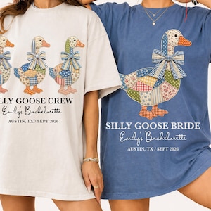 May include: Two t-shirts, one white and one blue, featuring a patchwork goose design. The white shirt reads "SILLY GOOSE CREW" and the blue shirt says "SILLY GOOSE BRIDE". Both shirts have "Emily's Bachelorette" and the location and date printed below.