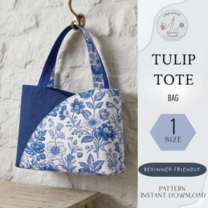 May include: A blue and white floral tote bag with a curved design. The bag features a blue handle and a white background with blue floral patterns. The text "TULIP TOTE BAG" is visible, along with "1 SIZE" and "BEGINNER FRIENDLY".