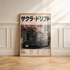 Peut inclure: Une affiche encadrée représentant une Acura NSX noire garée devant un bâtiment avec des cerisiers en fleurs. Le texte inclut "SAKURA DRIFT", "JDM CULTURE SERIES" et "ACURA NSX NA1/1990-2005". Le design intègre des caractères japonais et des spécifications techniques.