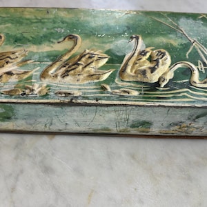 Rare, rectangular Art Deco 1920's antique/vintage swan metal tin box, decorated with white swans and distressed green- blue patina.