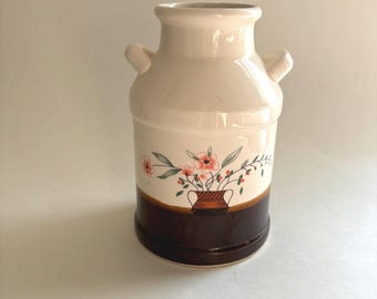 Vintage, brown and cream-colored utensil crock, or vase, with painted flowers for country/ farmhouse or cottage core style kitchen storage