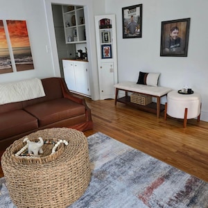 May include: A rustic wooden sign with the text "Welcome to our home" in white lettering. The sign features a distressed finish and a simple, inviting design, perfect for entryway decor.