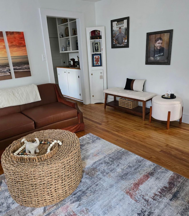 May include: A rustic wooden sign with the text "Welcome to our home" in white lettering. The sign features a distressed finish and a simple, inviting design, perfect for entryway decor.
