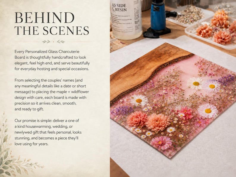 May include: A personalized glass charcuterie board with a wooden edge and a floral design. The board features a pink background with embedded flowers in shades of white, pink, and purple. The text "BEHIND THE SCENES" is visible.
