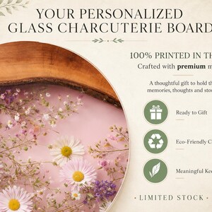 May include: A personalized glass charcuterie board with a wooden edge, featuring a pink floral design with daisies and other flowers. The text reads "YOUR PERSONALIZED GLASS CHARCUTERIE BOARD" and "100% PRINTED IN THE USA".