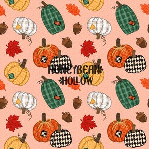 May include: A repeating pattern on a light peach background featuring pumpkins in various colours including orange, green, white, and black and white checkered, along with brown acorns and red maple leaves. The text HONEYBEAN HOLLOW is centred.
