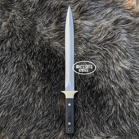 A hand-forged D2 tool steel toothpick knife with Micarta handle — a tiny, obsessively-crafted EDC piece that straddles the line between functional tool and miniature art object.