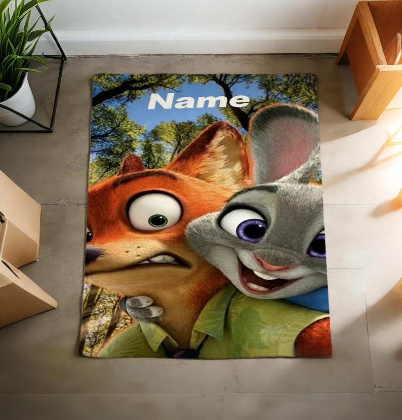 May include: A rectangular rug featuring the animated characters Nick Wilde and Judy Hopps from Zootopia. The rug has a blue sky and tree background, with the word "Name" in white letters at the top.
