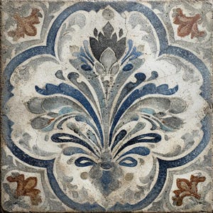 May include: Square tile with a floral design in shades of blue, gray, and brown. The central motif is a stylized flower with curved leaves and petals. The tile has a distressed, aged appearance.
