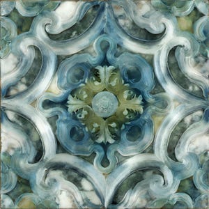 May include: Square tile with a symmetrical design in shades of blue, green, and white. The pattern features swirling, stylized floral and scroll motifs, creating a decorative, artistic appearance. The tile has a marble-like texture.