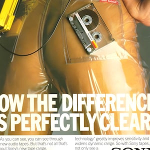 May include: A clear plastic garment with a Sony HF90 cassette tape in a pocket. The image has text that reads "SHOW THE DIFFERENCE IS PERFECTLY CLEAR".