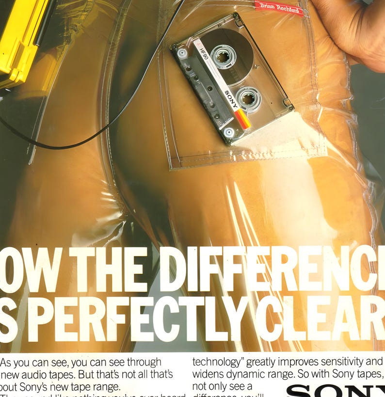 May include: A clear plastic garment with a Sony HF90 cassette tape in a pocket. The image has text that reads "SHOW THE DIFFERENCE IS PERFECTLY CLEAR".