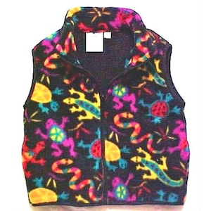 May include: A black fleece vest with a colorful print of lizards, snakes, and other animals. The vest has a zipper closure and a stand-up collar.