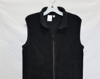 Black fleece vest for men or women with inside zip pocket,  Unisex sizes.   Premium fleece from Polartec LLC.  Choose your size