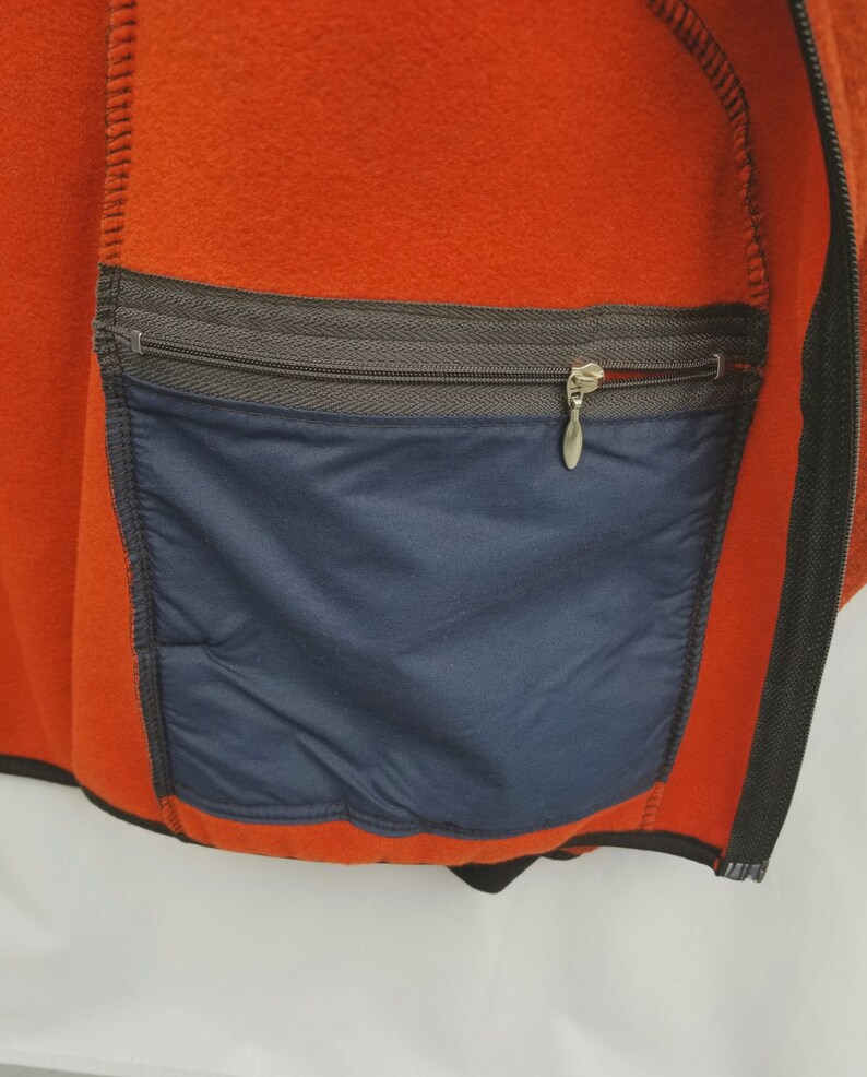 . Inside zip pocket. Small or Medium FIRECRACKER Red Polartec Fleece Jacket. Unisex size.