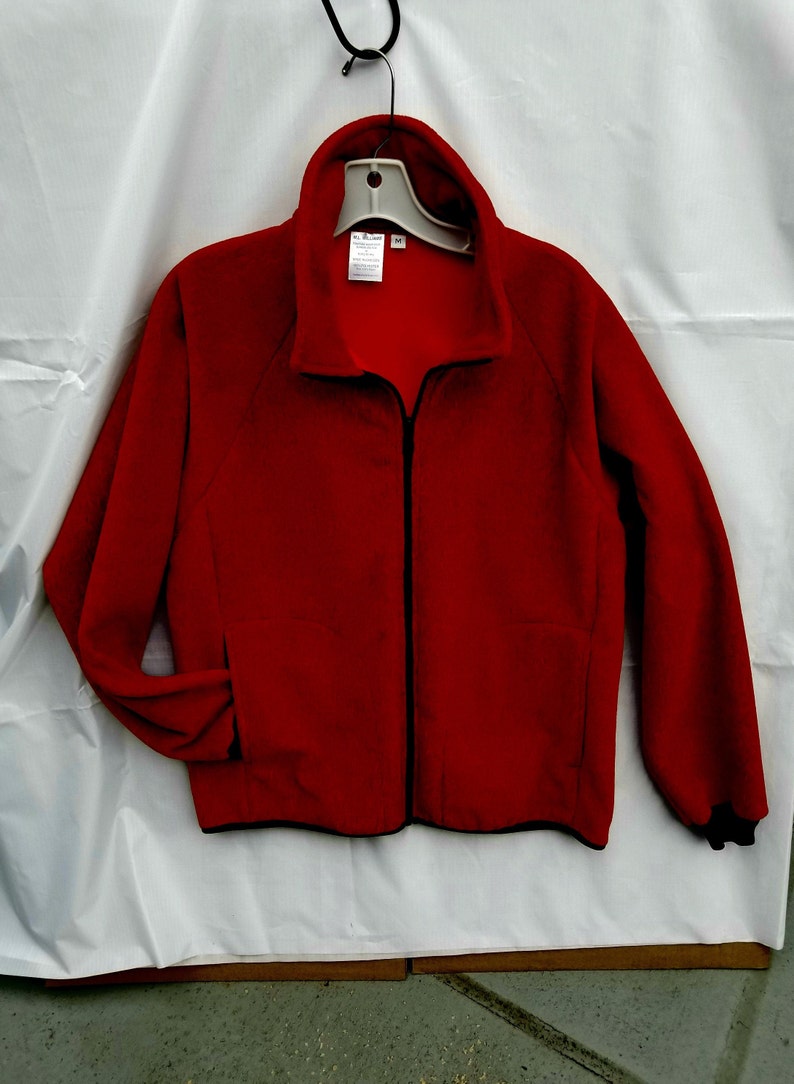 . Inside zip pocket. Small or Medium FIRECRACKER Red Polartec Fleece Jacket. Unisex size.